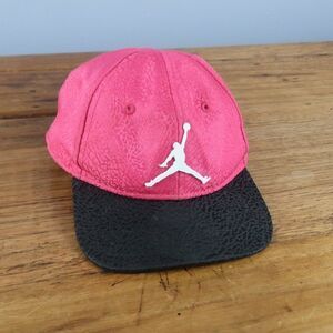 JORDAN JUMPMAN PINK & BLACK SNAPBACK INFANT BASEBALL CAP WITH WHITE METAL LOGO